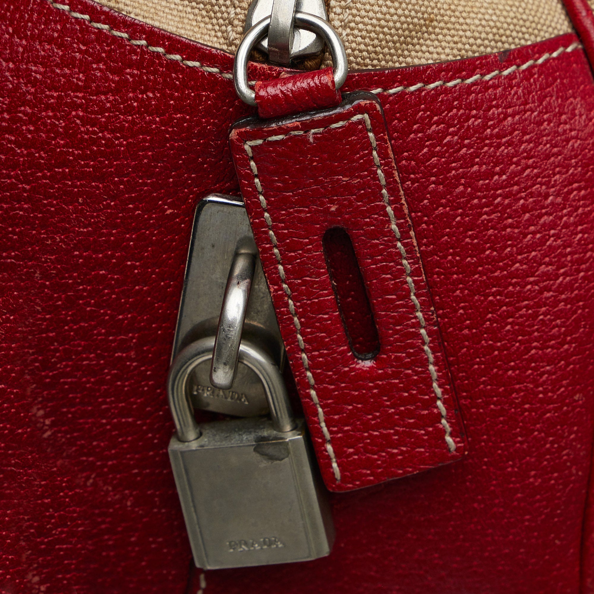 Prada Bauletto hand bag. Used handbag. Color brown and red. Offers